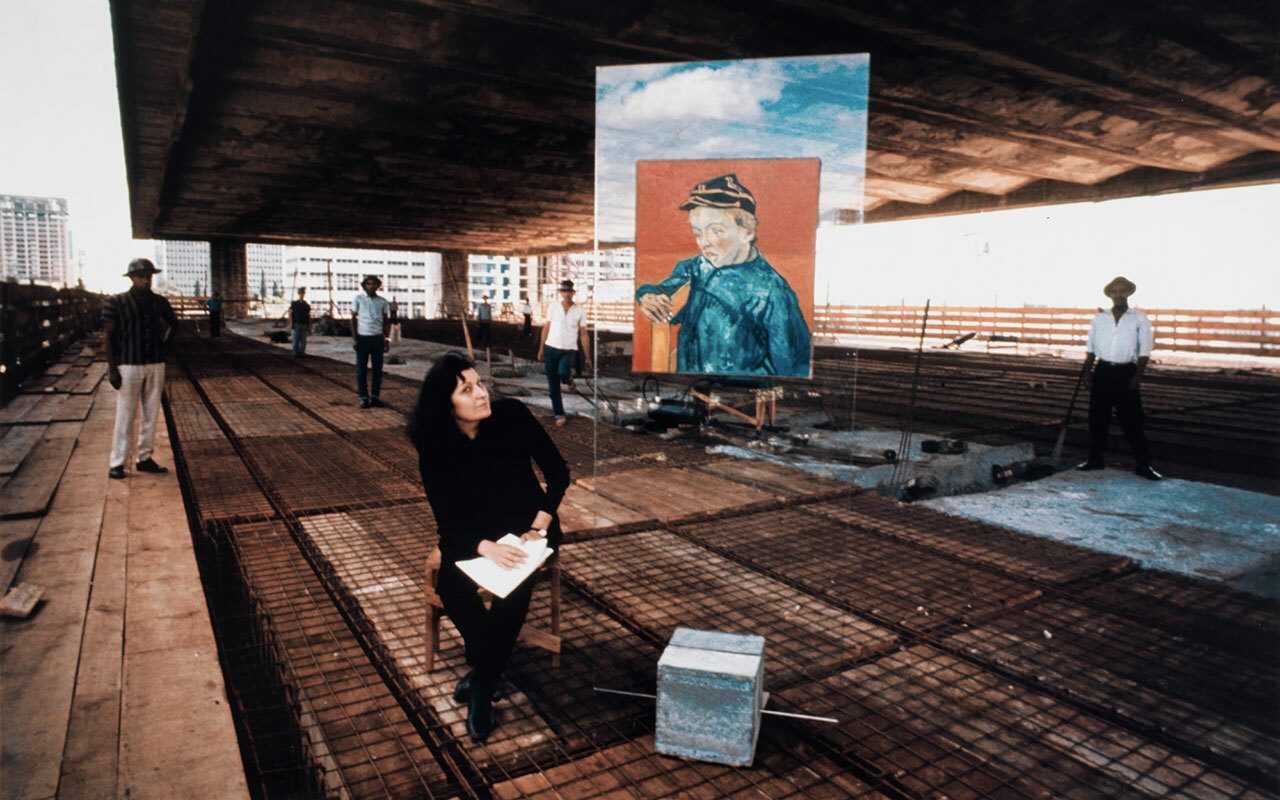 Portrait Lina Bo Bardi and glass easel with a Van Gogh at MASP construction site courtesy Instituto Bardi